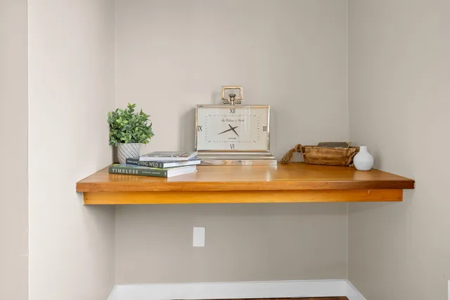 a kitchen with a stove top oven and refrigerator
