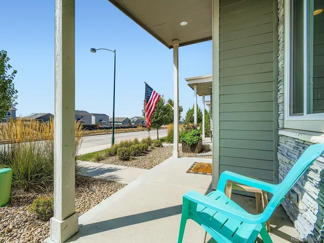 a view of a balcony with a table and chairs