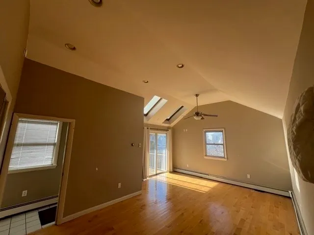 a view of an empty room with a window