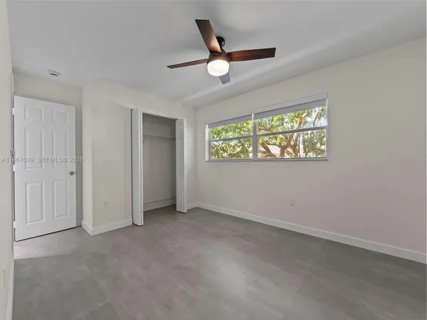 a view of an empty room with a window