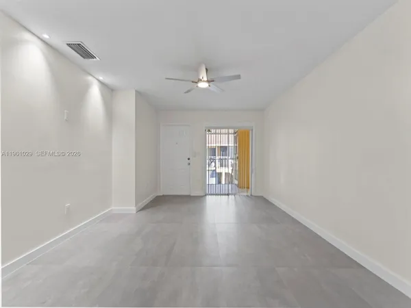 a view of an empty room with a window