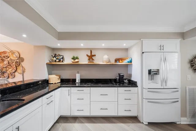 a kitchen with granite countertop lots of counter top space and furniture