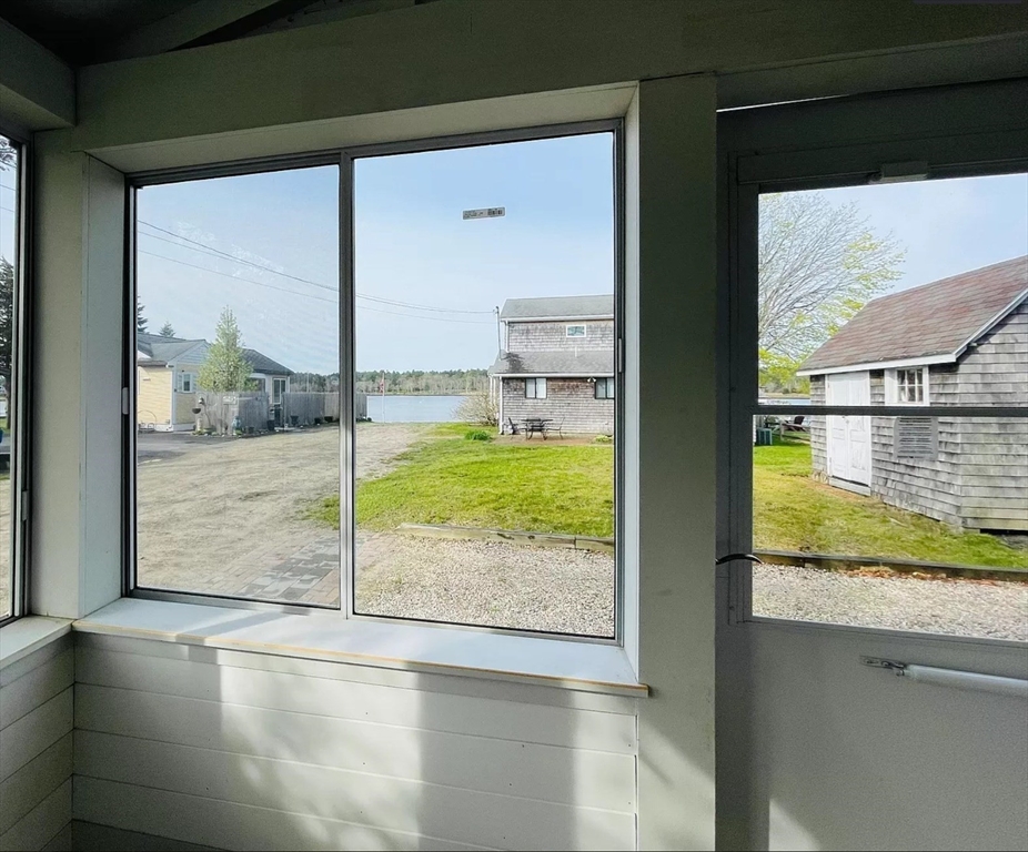 37 Lincoln Highway Wareham, MA 02571 - Photo 8 of 29 a view of a room with wooden floor and a floor to ceiling window