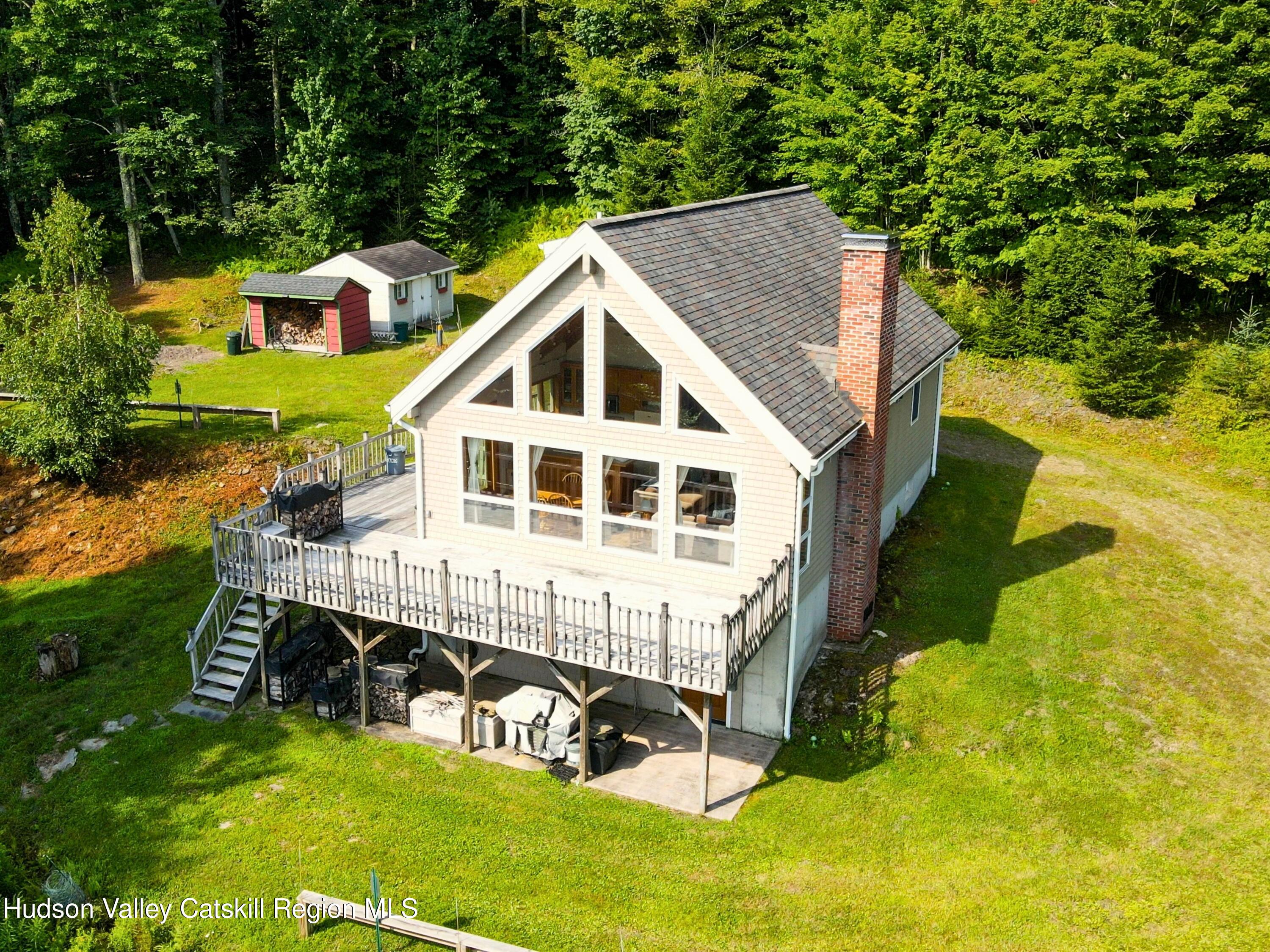 a view of a house with a yard balcony