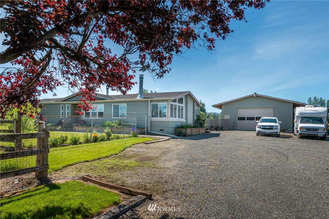 1475 East Smith Road Bellingham, WA 98226 - Photo 3 of 27 a house view with a sitting space and garden
