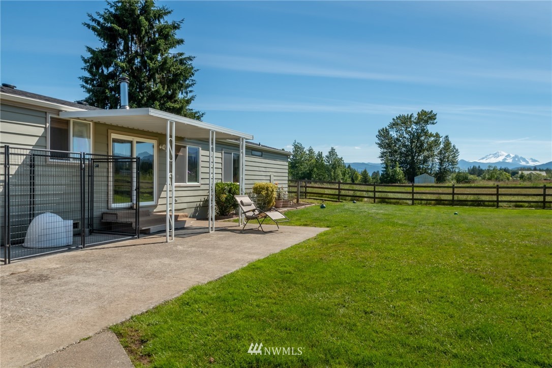1475 East Smith Road Bellingham, WA 98226 - Photo 5 of 27 a view of a house with a yard and sitting area
