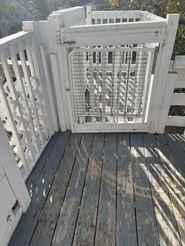 a view of balcony with wooden floor