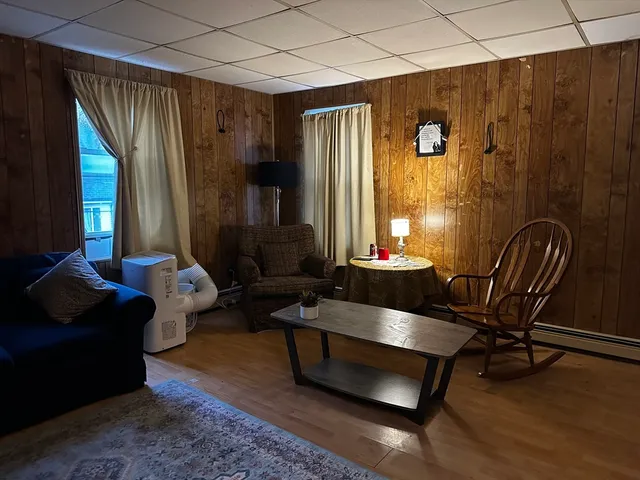 a living room with furniture and a window