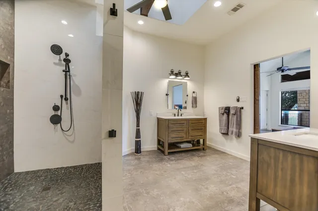 a bathroom with a sink and mirror