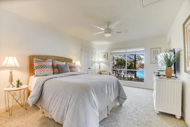 a view of a patio with a table chairs and a chandelier