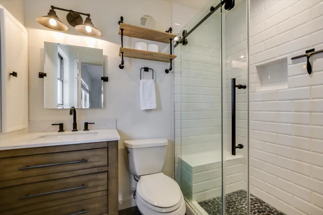 a view of a porch with a table and chairs