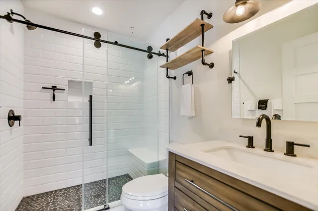 a view of a swimming pool with a patio and a yard