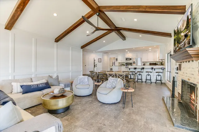 a dinning area with furniture and kitchen view