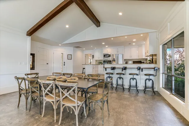 a spacious bedroom with a bed and couch