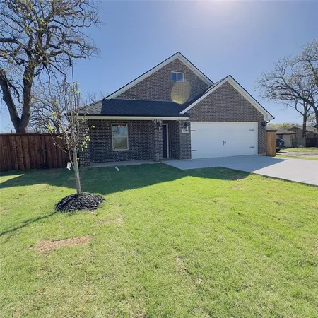 a front view of a house with yard