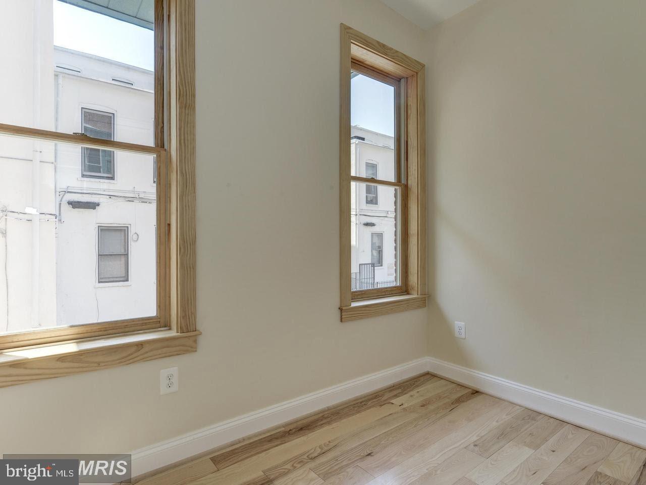 1102 5th Street Northwest, Unit 3 Washington, DC 20001 - Photo 8 of 11 an empty room with windows