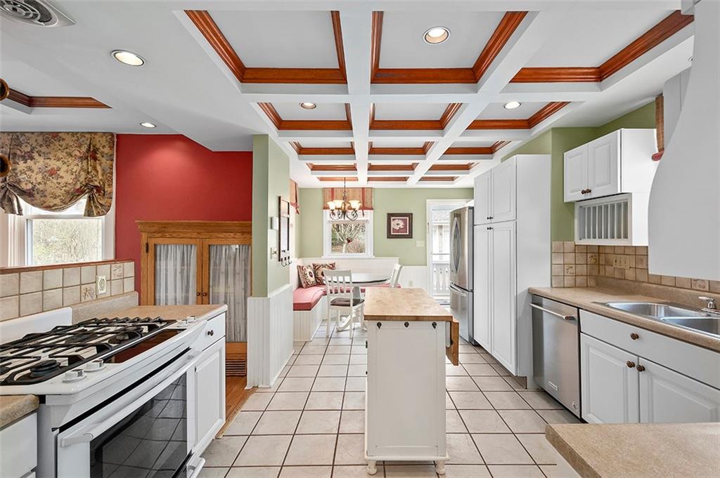 294 Arden Road Pittsburgh, PA 15216 - Photo 11 of 25 a kitchen with sink stove and cabinets