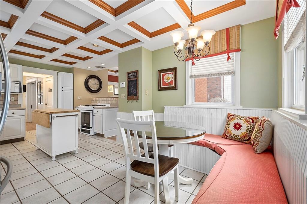 294 Arden Road Pittsburgh, PA 15216 - Photo 12 of 25 a living room with a couch and a chandelier