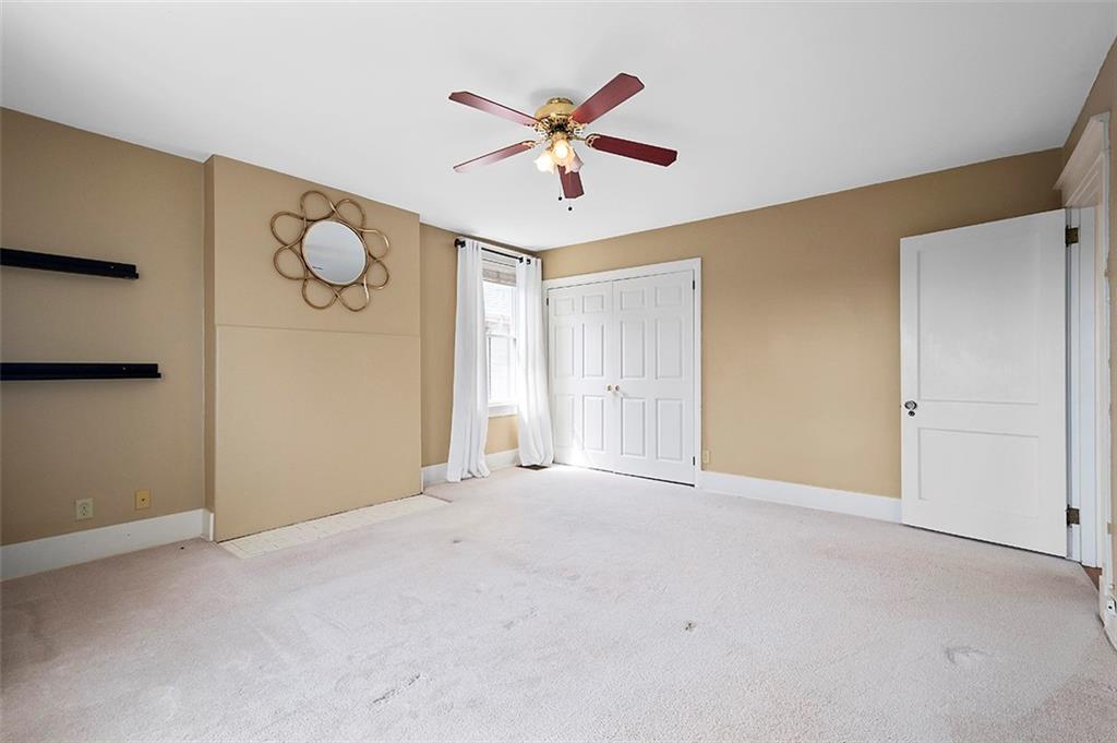 294 Arden Road Pittsburgh, PA 15216 - Photo 13 of 25 a view of an empty room with a ceiling fan