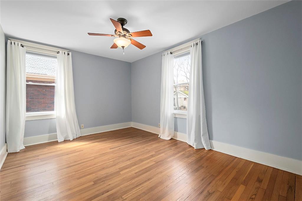 294 Arden Road Pittsburgh, PA 15216 - Photo 14 of 25 an empty room with wooden floor and windows
