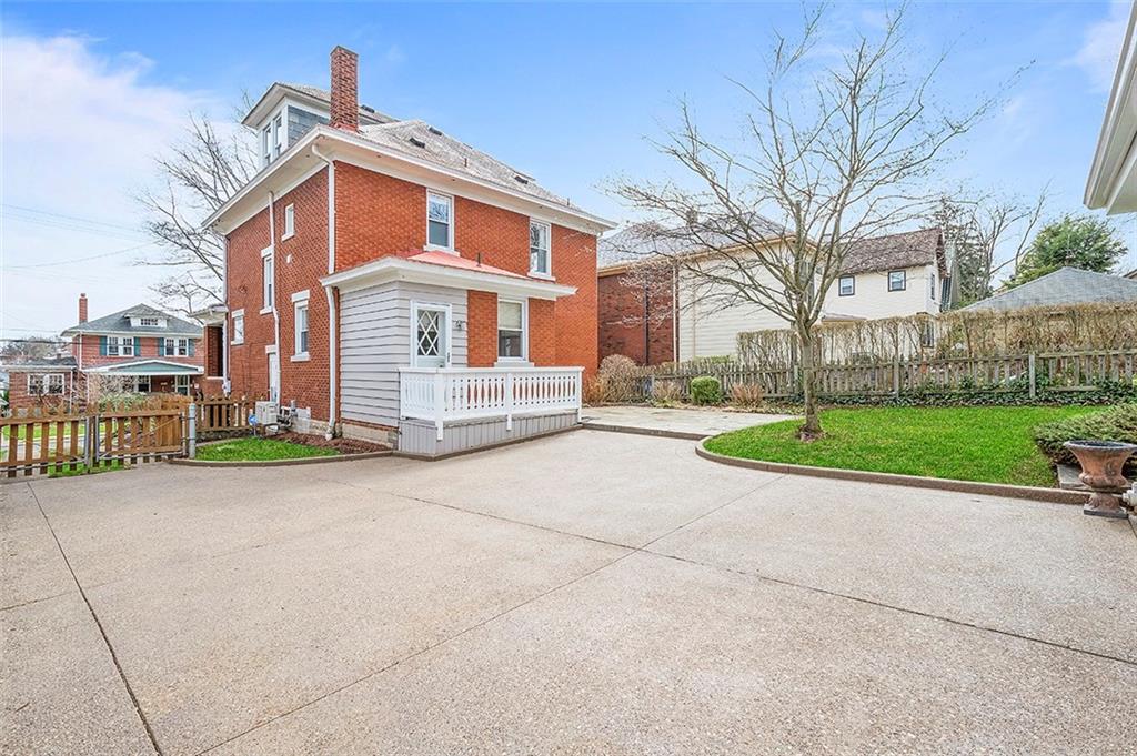 294 Arden Road Pittsburgh, PA 15216 - Photo 21 of 25 a front view of a house with a yard and garage