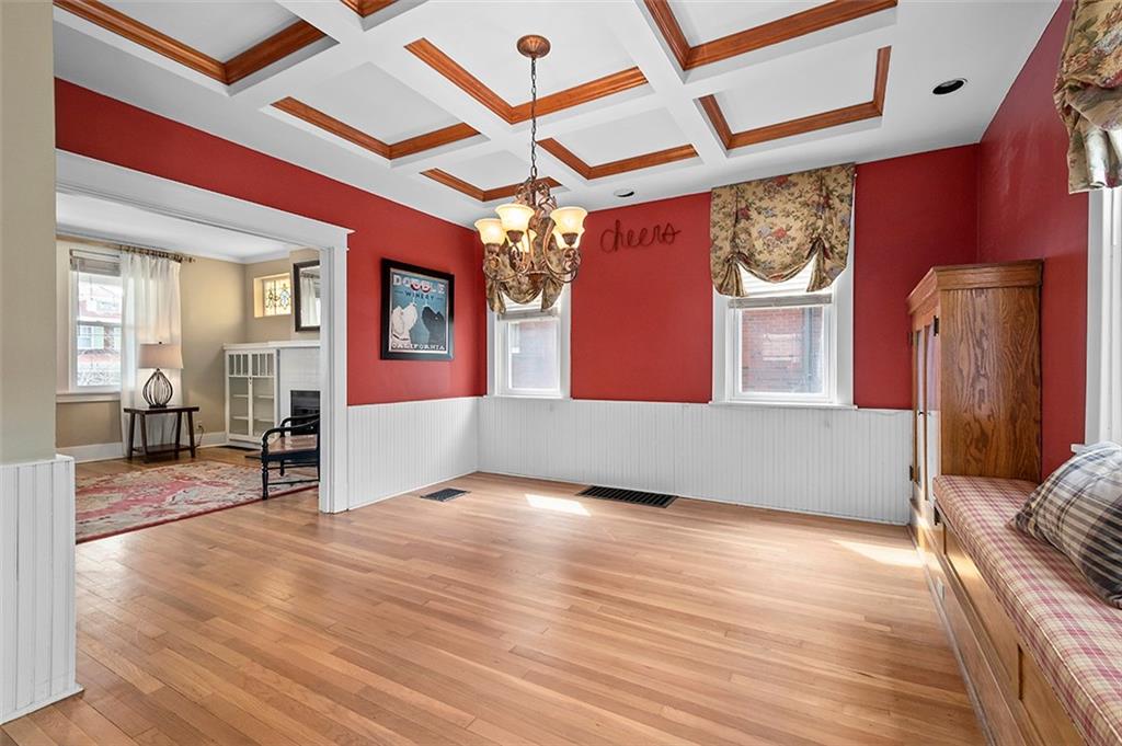 294 Arden Road Pittsburgh, PA 15216 - Photo 9 of 25 a view of a livingroom with wooden floor and chandelier