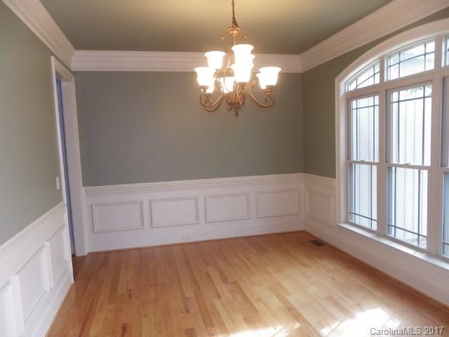 1808 Sam Smith Road Fort Mill, SC 29708 - Photo 2 of 20 a view of empty room with wooden floor and fan