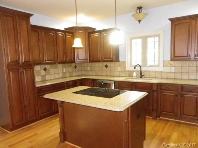 1808 Sam Smith Road Fort Mill, SC 29708 - Photo 3 of 20 a kitchen with a sink a counter space and cabinets