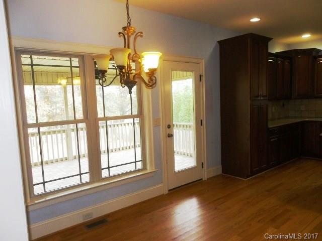1808 Sam Smith Road Fort Mill, SC 29708 - Photo 5 of 20 a view of a livingroom with a chandelier wooden floor and a window