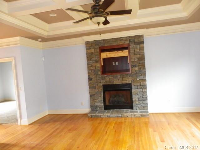 1808 Sam Smith Road Fort Mill, SC 29708 - Photo 6 of 20 a view of empty room with a fireplace and wooden floor