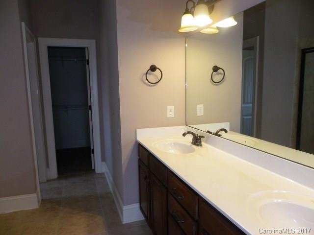 1808 Sam Smith Road Fort Mill, SC 29708 - Photo 9 of 20 a bathroom with a sink vanity and a mirror