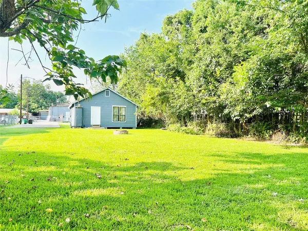 a house view with swimming pool in front of it