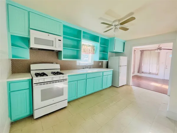 a kitchen with a stove and a sink