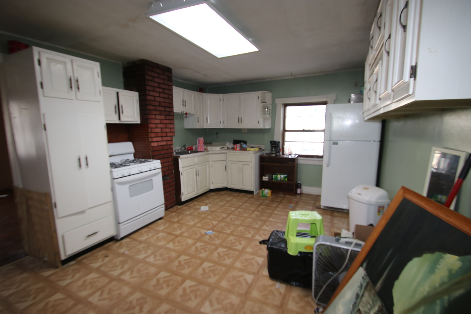 47 North Pistakee Lake Road Fox Lake, IL 60020 - Photo 4 of 15 a kitchen with refrigerator and cabinets