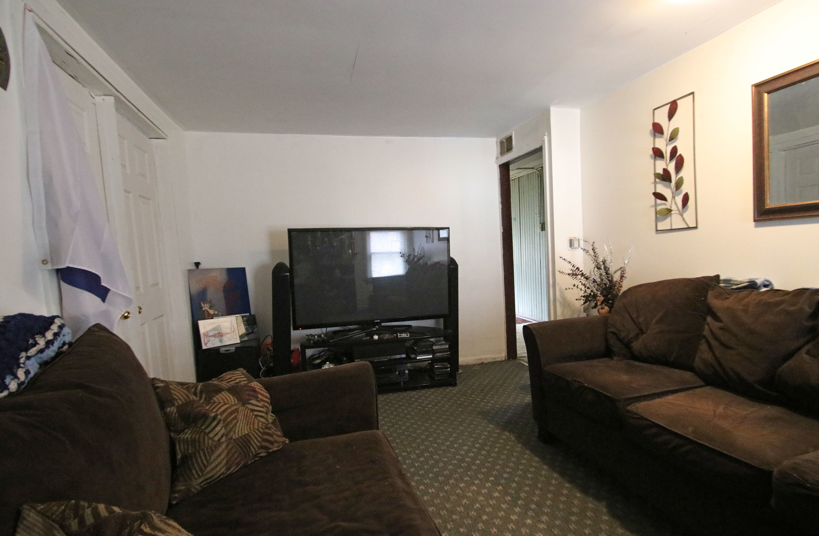 47 North Pistakee Lake Road Fox Lake, IL 60020 - Photo 9 of 15 a living room with furniture and a flat screen tv