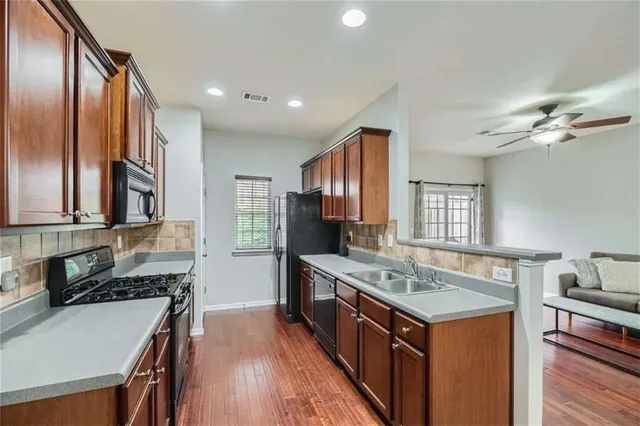 a kitchen with a stove and a sink
