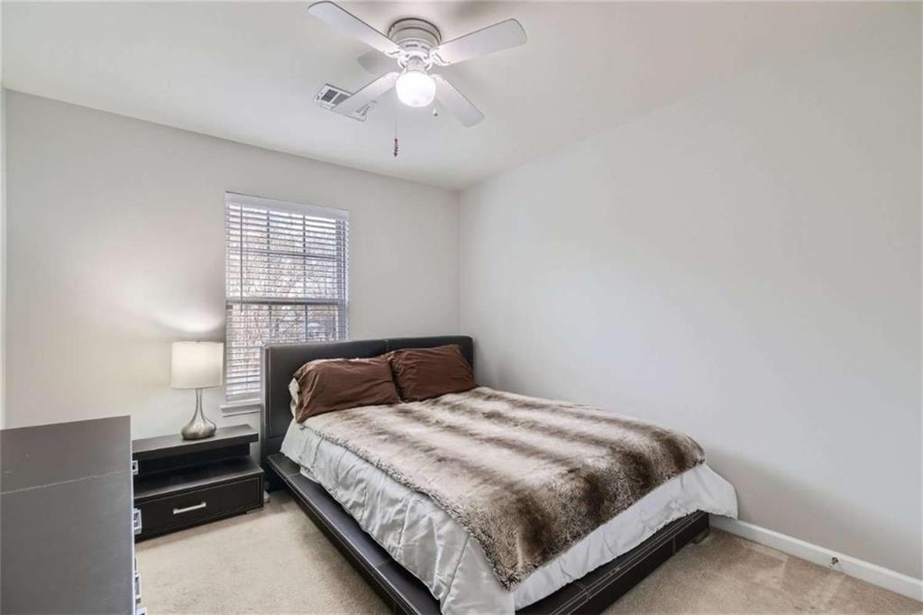 2296 Leicester Way Southeast Atlanta, GA 30316 - Photo 8 of 11 a bedroom with a bed and a window