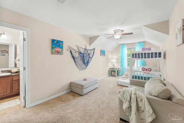 a bedroom with furniture and a chandelier