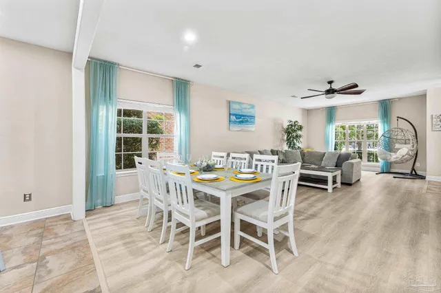 a dining room with furniture and window