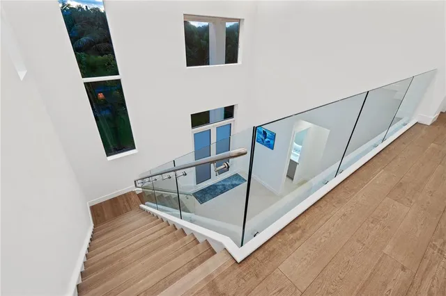 a spacious bedroom with a large bed and a view of bathroom