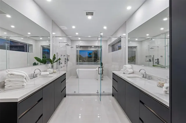 a living room with a bed furniture and a large window