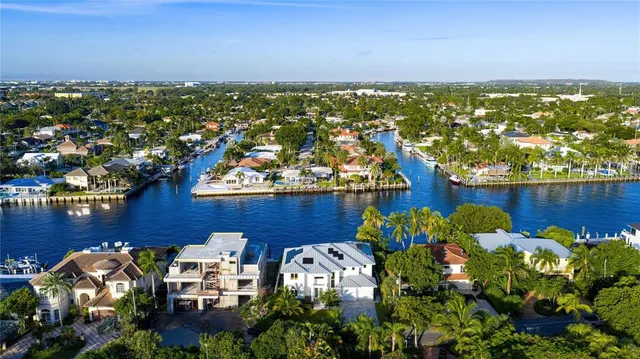 a view of a living room with furniture window and wooden floor