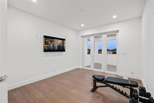 a bathroom with a granite countertop sink a toilet a shower and a mirror