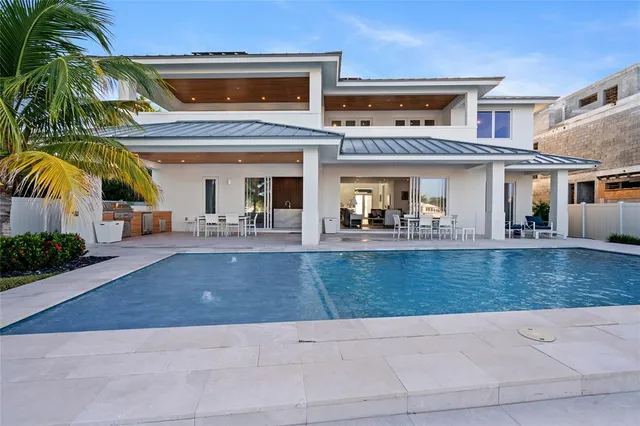 a view of a swimming pool with an outdoor seating