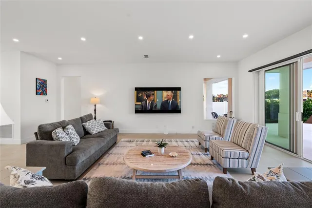 a view of living room with furniture and flat screen tv
