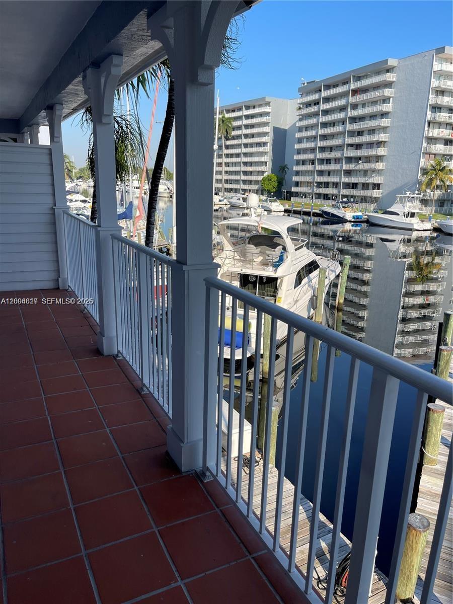 2415 Northwest 16th St Road, Unit 102 Miami, FL 33125 - Photo 13 of 19 a view of balcony with furniture