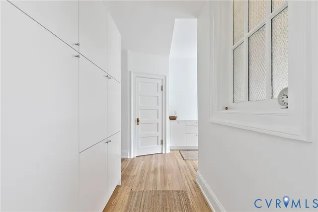 a view of a kitchen with a sink and a washer dryer