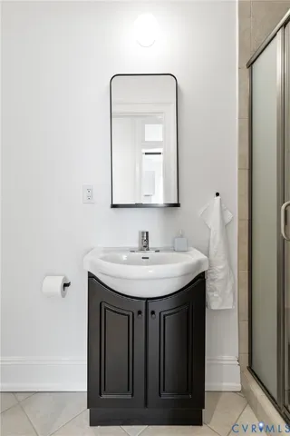 an aerial view of residential houses with outdoor space and street view