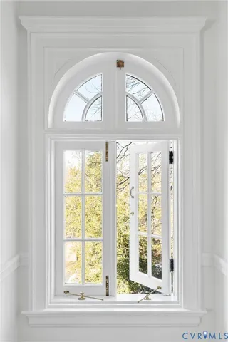 a view of a wooden door with a glass door