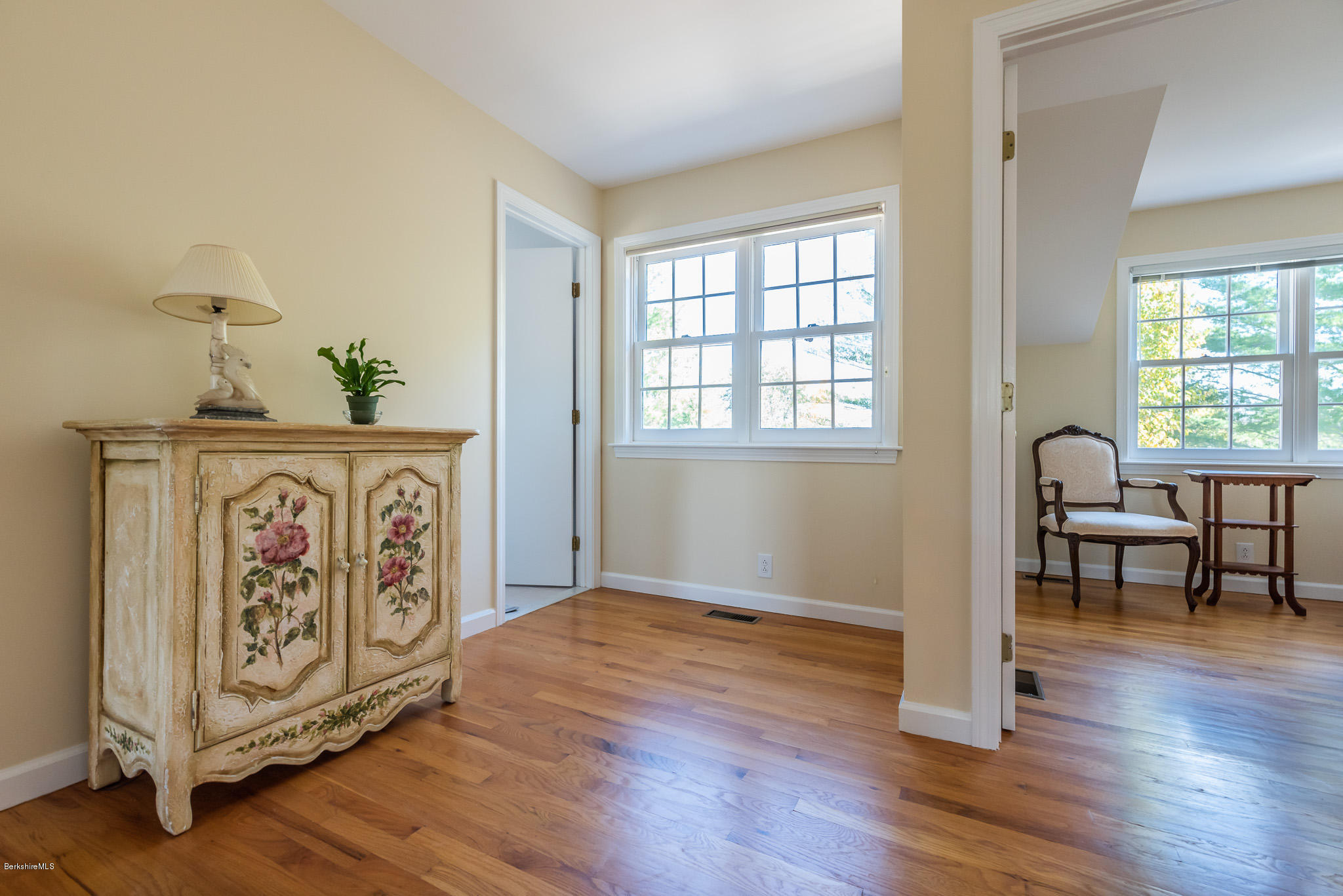 1136 Barker Road, Unit 28 Pittsfield, MA 01201 - Photo 16 of 34 a view of front door with dining area wooden floor and a table